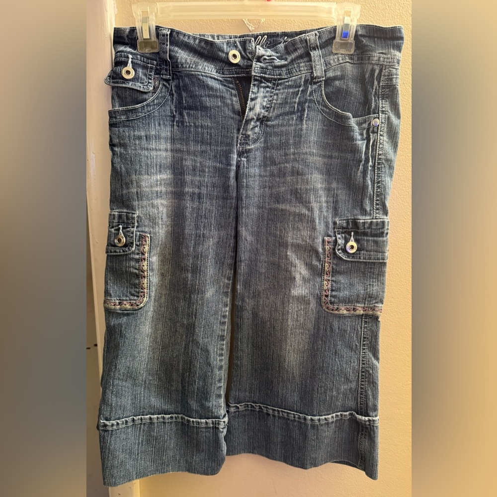 Blue Jean guachos with pink and yellow hem on the pockets